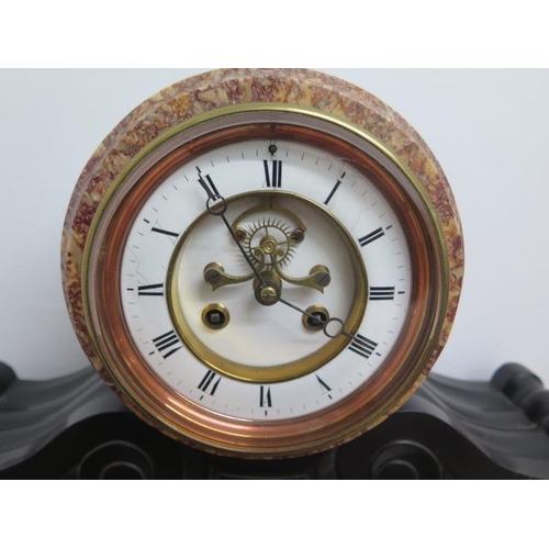 445 - An antique black and red variegated marble 8 day mantle clock, visible Brocot escapement and enamell... 