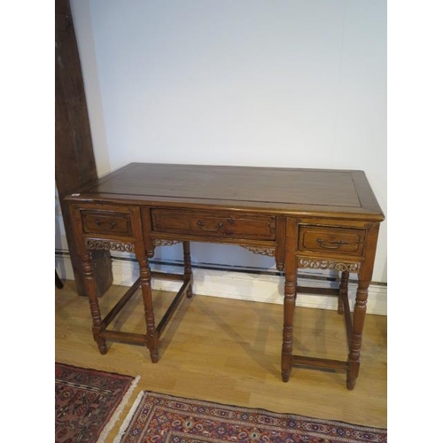 461 - An unusual Chinese hardwood freestanding three drawer side table on turned supports in three parts, ... 