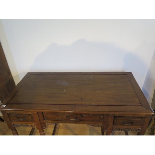 461 - An unusual Chinese hardwood freestanding three drawer side table on turned supports in three parts, ... 