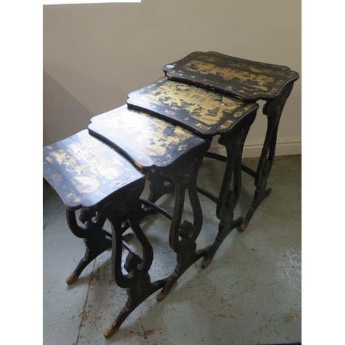 517 - A nest of four black lacquered gilt decorated chinoiserie side tables - Height 69cm x 50cm x 33cm