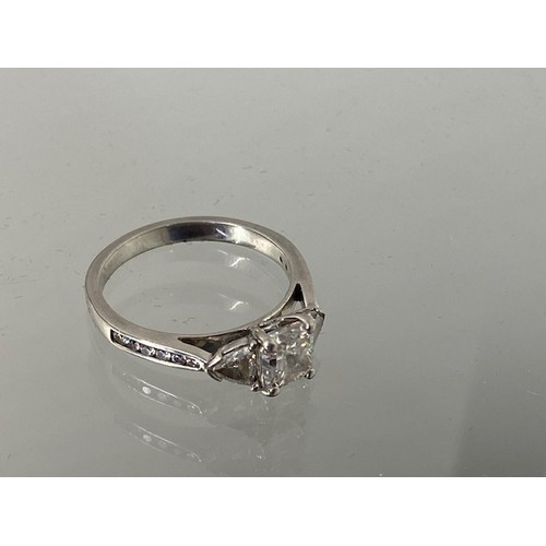 1 - A good quality 950 platinum three stone diamond ring with a central cushion cut diamond, carat weigh... 