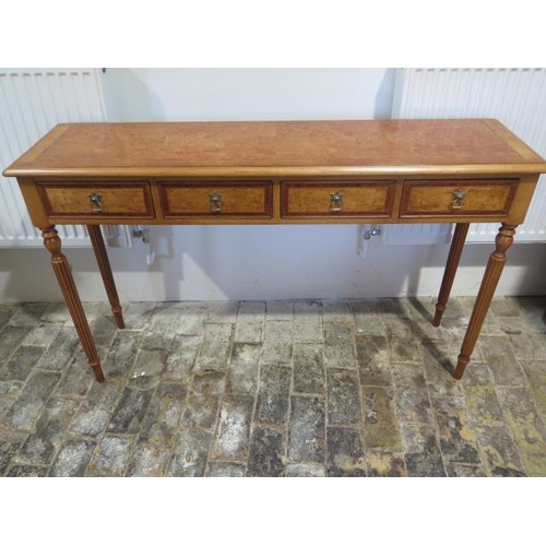 521 - A new burr Birchwood four drawer hall table on turned reeded legs made by a local craftsman to a hig... 
