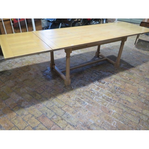 515 - A Neptune light oak draw leaf refectory style dining table on turned supports - Height 75cm x Width ... 