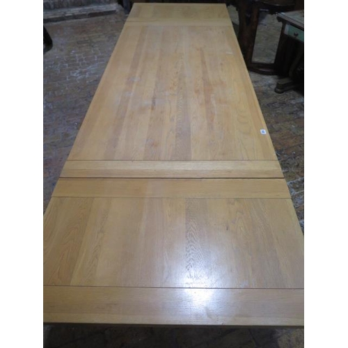 515 - A Neptune light oak draw leaf refectory style dining table on turned supports - Height 75cm x Width ... 