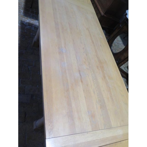 515 - A Neptune light oak draw leaf refectory style dining table on turned supports - Height 75cm x Width ... 