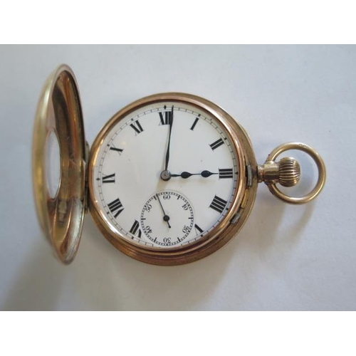 148 - A 9ct yellow gold half hunter pocket watch, top wind, 46mm case, running - approx weight 67 grams, g... 