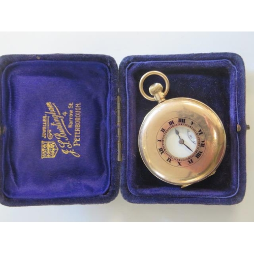 148 - A 9ct yellow gold half hunter pocket watch, top wind, 46mm case, running - approx weight 67 grams, g... 