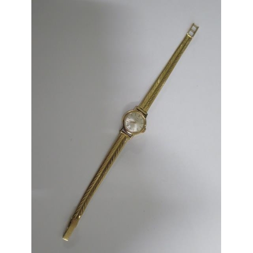 154 - An 18ct yellow gold Tissot ladies manual wind watch on 18ct gold strap - 17mm case, approx weight 20... 