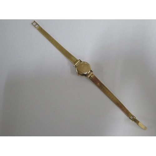 154 - An 18ct yellow gold Tissot ladies manual wind watch on 18ct gold strap - 17mm case, approx weight 20... 