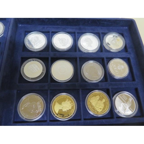 184 - A collection of 27 silver coins to include five gold clad Queen Mother coins, two Britinnia's approx... 