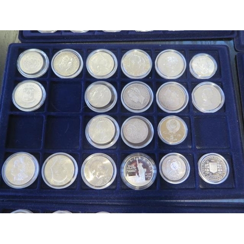 191 - A collection of commemorative crowns and other coins on five trays to include seven silver crowns da... 