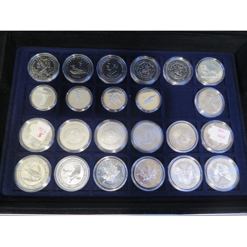 192 - A collection of World commemorative crowns and other coins including six 1oz fine silver coins