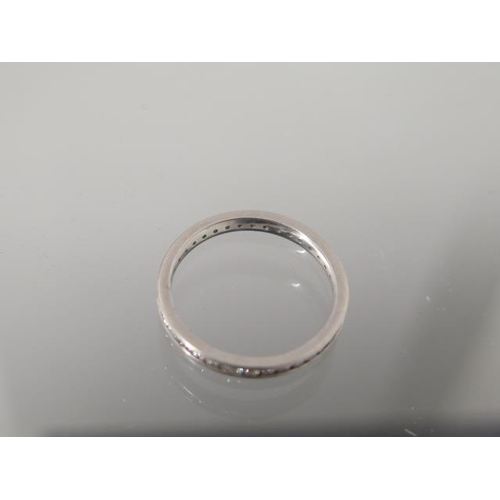 2 - A platinum diamond eternity ring set with 38 stones assessed colour F/G, clarity VS1/VS2 - total app... 