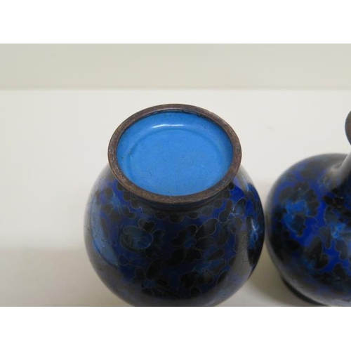 217 - A pair of cloisonné enamel vases - Height 15cm - both generally good