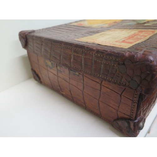 225 - A good early 20th century vintage crocodile suitcase with a fitted green leather interior with two s... 