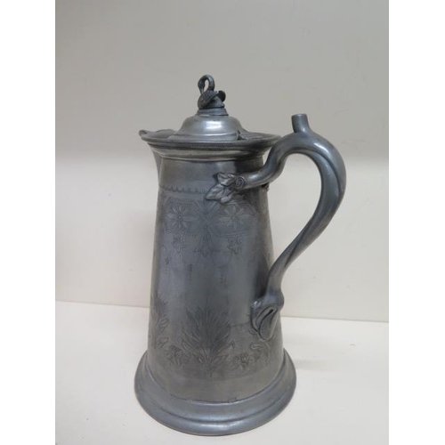 244 - A large Pewter type metal lidded beer/water jug - Height 33cm - denting to base otherwise reasonably... 