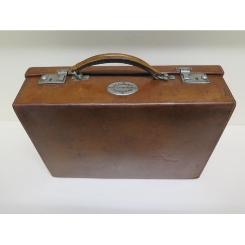 247 - A good quality early 20th century leather attache/travel case by Finnigans Ltd Manchester with a pla... 