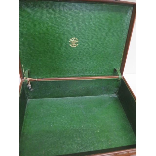 247 - A good quality early 20th century leather attache/travel case by Finnigans Ltd Manchester with a pla... 