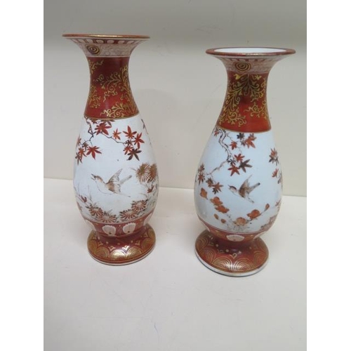 249 - A near pair of Kutani bird decorated vases signed to the base - Height 25cm - restoration to base an... 