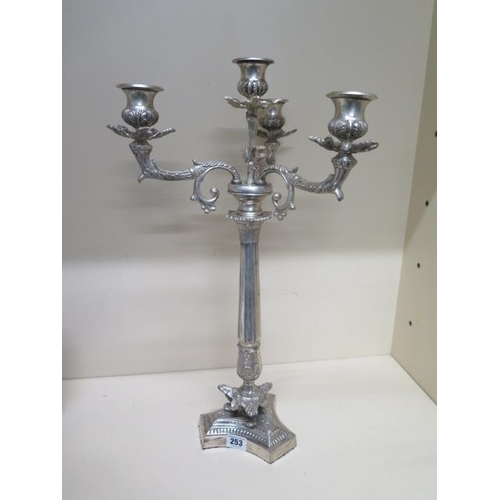 253 - A triform polished metal candelabra - Height 55cm