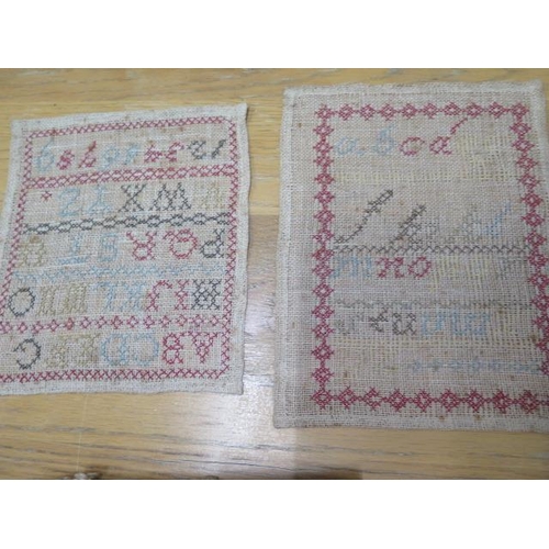 258 - Two needlework sampler books and three unframed needlework samplers one dated 1879 - 20cm x 23cm