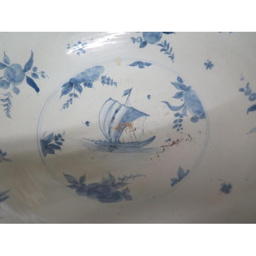 267 - A large Delft blue and white bowl decorated with ships, villas and fruit - Height 20cm x Diameter 44... 