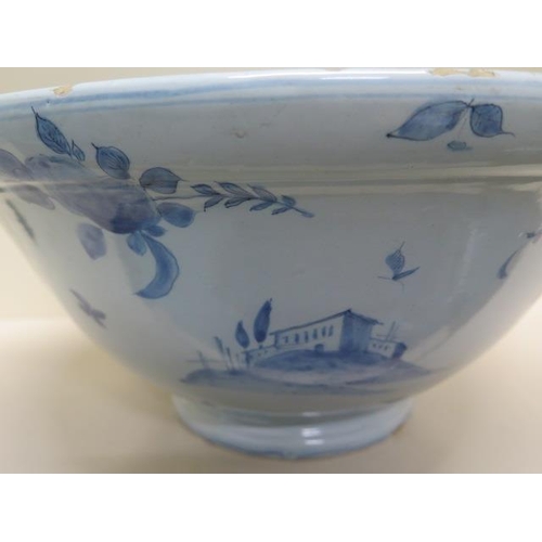 267 - A large Delft blue and white bowl decorated with ships, villas and fruit - Height 20cm x Diameter 44... 