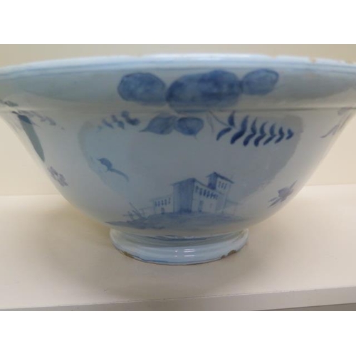 267 - A large Delft blue and white bowl decorated with ships, villas and fruit - Height 20cm x Diameter 44... 