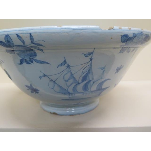 267 - A large Delft blue and white bowl decorated with ships, villas and fruit - Height 20cm x Diameter 44... 