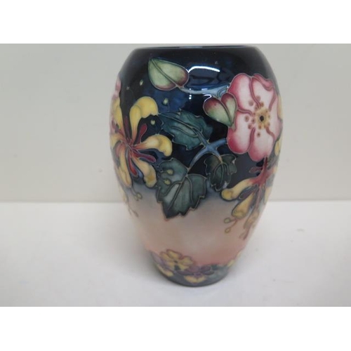 269 - A Moorcroft green initialled vase - Height 18cm - good condition