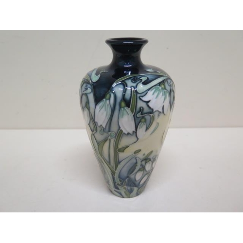 274 - A Moorcroft snowdrop vase - Height 16cm