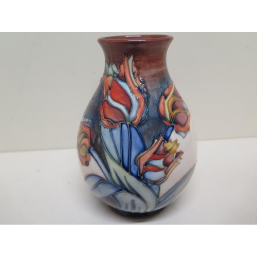 277 - A Moorcroft red tulip vase - Height 19cm - some crazing to base