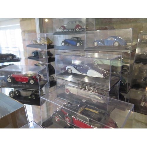 306 - A collection of 53 Diecast classic cars all in display boxes and a Liner Britannic