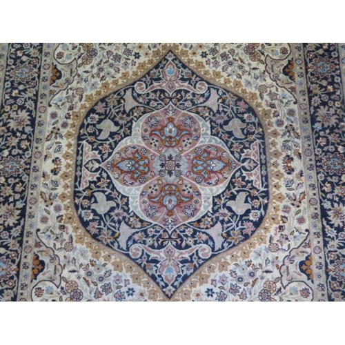 382 - A hand knotted woolen Tabriz rug - 1.90m x 1.25m - in good condition