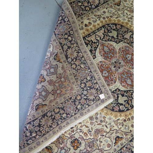 382 - A hand knotted woolen Tabriz rug - 1.90m x 1.25m - in good condition