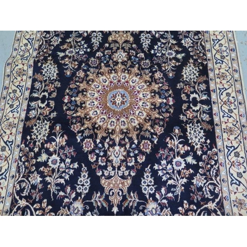 389 - A hand knotted woolen fine Nain rug - 1.95m x 1.24m - in good condition