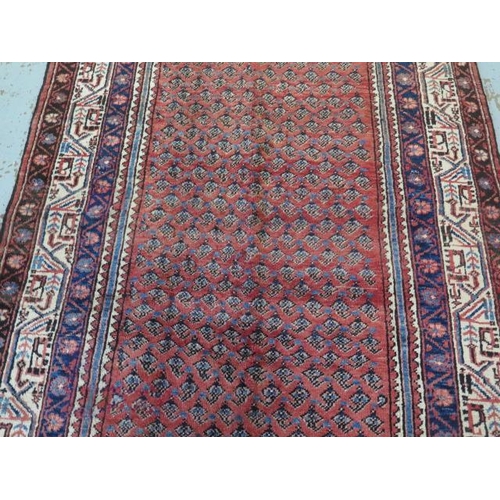 390 - A hand knotted woolen Araak rug - 2.05m x 1.30m - in good condition