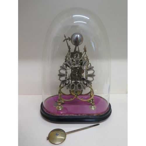 411 - A brass Cathedral  skeleton clock with a chain driven fusee movement striking on a bell under a glas... 
