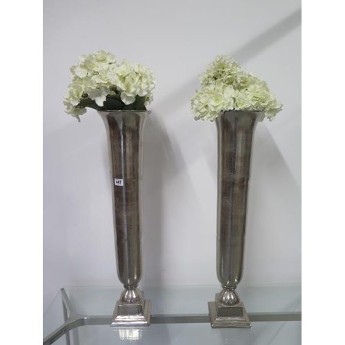 447 - A pair of Libra metallic vases - Height 74cm with foliage