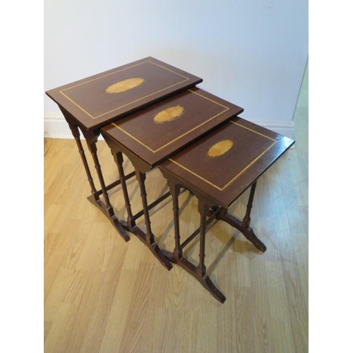 458 - A nest of three mahogany side tables with inlaid tops - Height 50cm x 49cm x 33cm