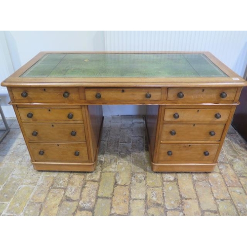470 - A Victorian light oak nine drawer twin pedestal desk with a leather inset top  small moulding loss  ... 
