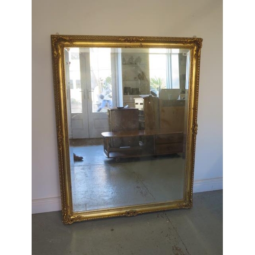 489 - A large modern gilt mirror - 139cm x 106cm