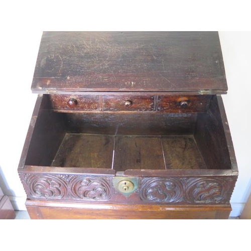 523 - An 18th century and later carved oak sloping front box on stand with three internal drawers - Height... 