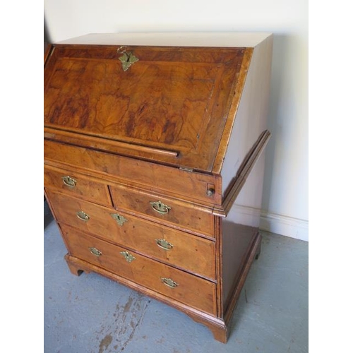 526 - An early 18th century walnut George l bureau with a fitted interior of small drawers and pigeon hole... 