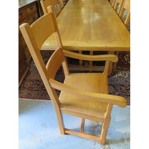 530 - A modern golden oak extending refectory table with two leaves and eight matching solid seat chairs i... 