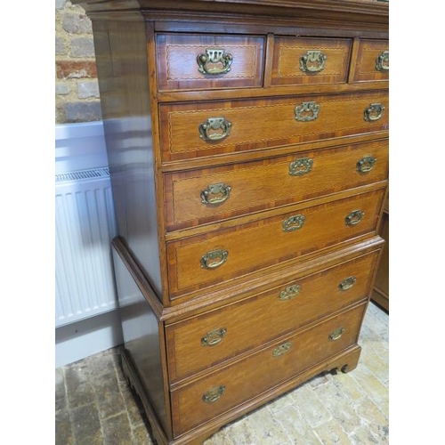 532 - A Georgian style oak chest on chest with crossbanded and inlaid drawers, three small over five long ... 