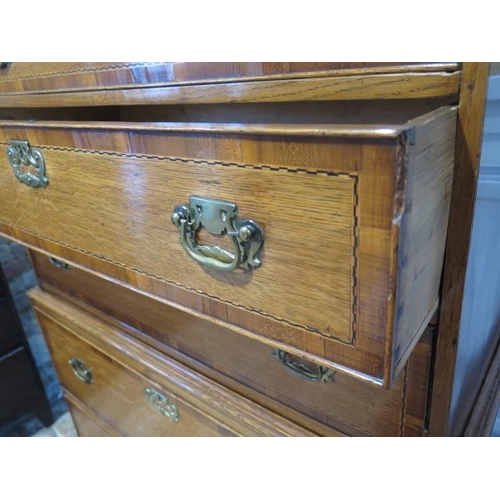 532 - A Georgian style oak chest on chest with crossbanded and inlaid drawers, three small over five long ... 