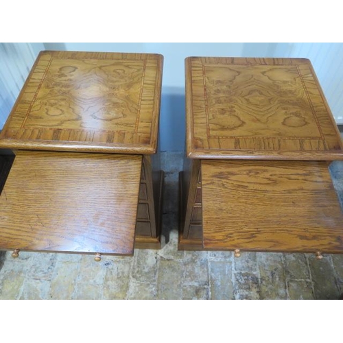 551 - A pair of new burr oak bedside chests with a brushing slide above four graduating drawers - made by ... 