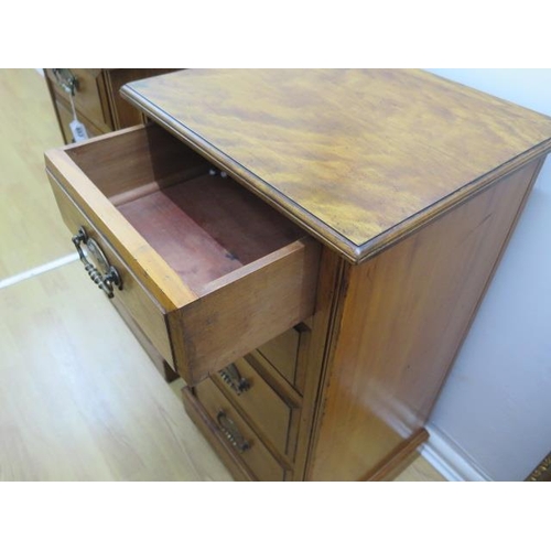 553 - A pair of satin walnut four drawer bedside chests - Height 79cm x 41cm x 37cm - in good polished con... 