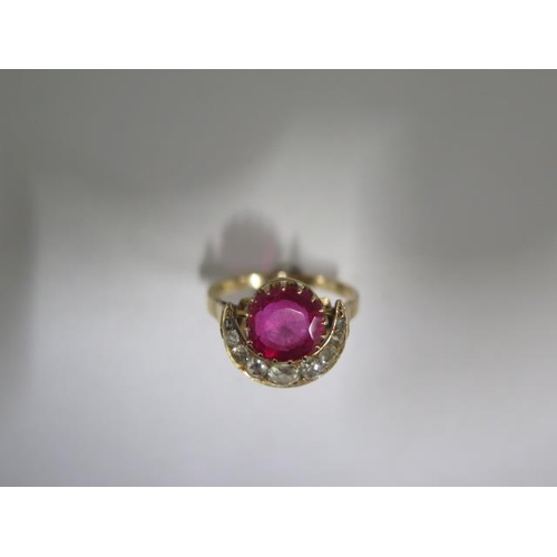 62 - A yellow gold ruby or spinel and diamond crescent ring the centre stone approx 9mm x 4.5mm - tests t... 